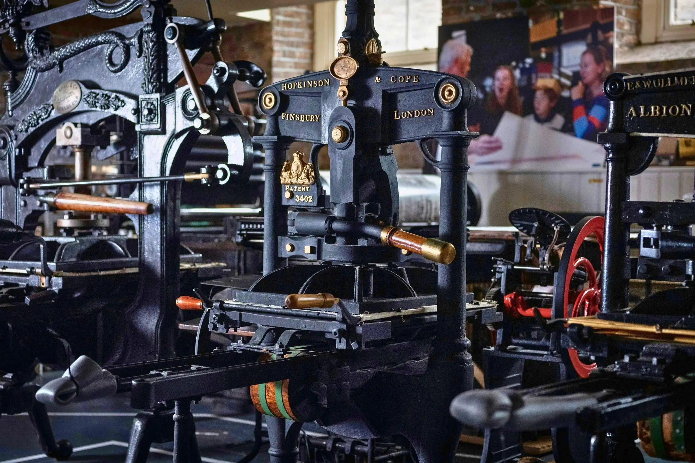 Rows of historical cast-iron printing presses inside the National Print Museum in Dublin